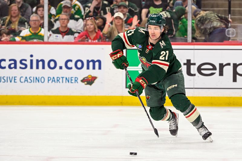 Apr 11, 2023; Saint Paul, Minnesota, USA;  Minnesota Wild forward Brandon Duhaime (21) makes a pass against the Winnipeg Jets during the third period at at Xcel Energy Center. Mandatory Credit: Nick Wosika-USA TODAY Sports