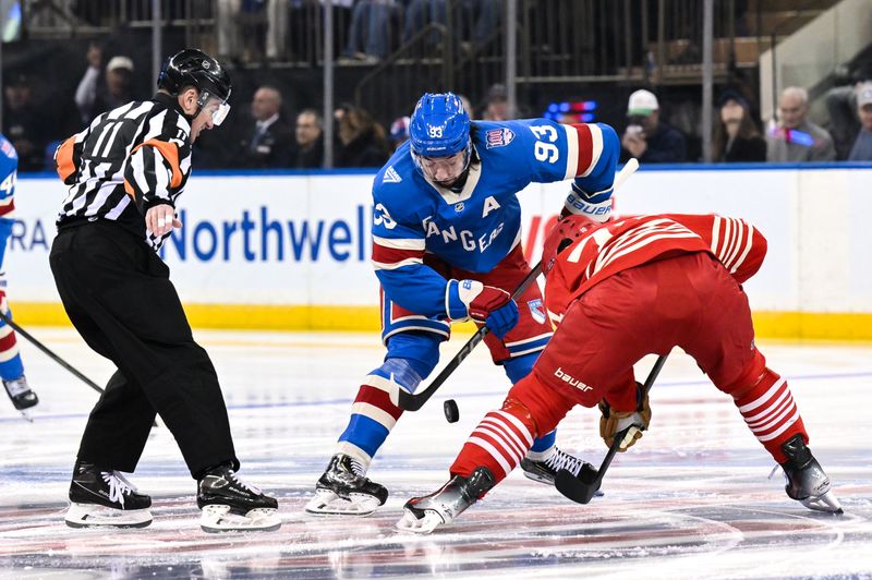 Nov 16, 2025; New York, New York, USA; New York Rangers center Mika Zibanejad (93) faces off against Detroit Red Wings center Dylan Larkin (71) during the first period at Madison Square Garden. Mandatory Credit: John Jones-Imagn Images