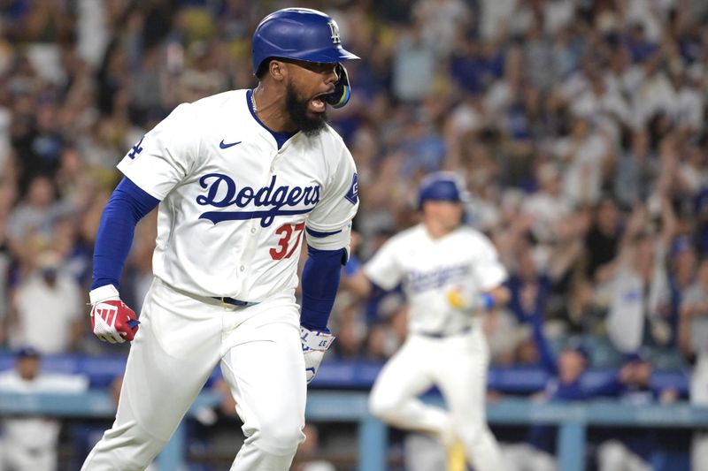 Jul 22, 2024; Los Angeles, California, USA; Los Angeles Dodgers left fielder Teoscar Hernandez (37) celebrates after hitting a RBI single in the eighth inning against the San Francisco Giants at Dodger Stadium. Mandatory Credit: Jayne Kamin-Oncea-USA TODAY Sports