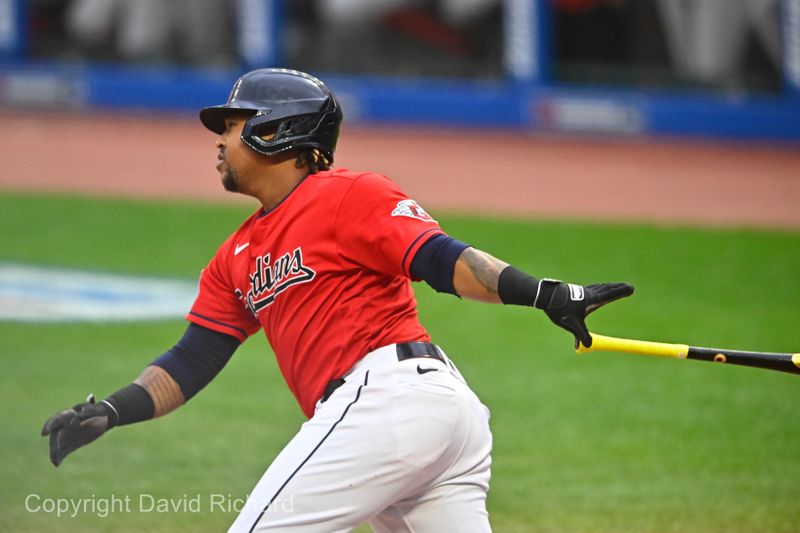 Sep 27, 2023; Cleveland, Ohio, USA; Cleveland Guardians designated hitter Jose Ramirez (11) singles in the first inning against the Cincinnati Reds at Progressive Field. Mandatory Credit: David Richard-USA TODAY Sports