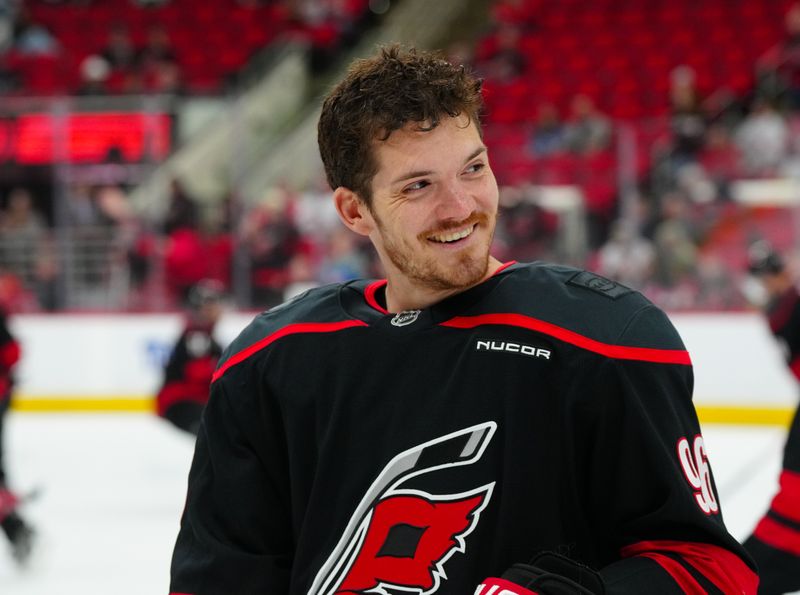 Mar 11, 2025; Raleigh, North Carolina, USA;  Carolina Hurricanes center Jack Roslovic (96) smiles during the warmups before the game against the Tampa Bay Lightning at Lenovo Center. Mandatory Credit: James Guillory-Imagn Images