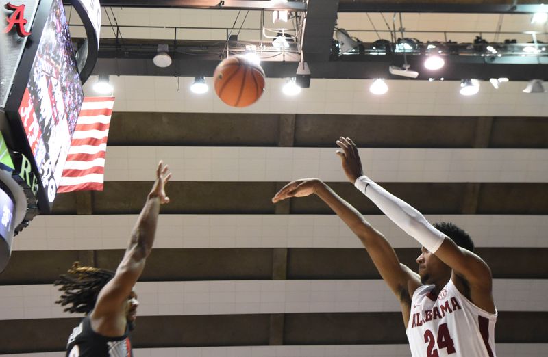 Feb 18, 2023; Tuscaloosa, Alabama, USA; Alabama Crimson Tide forward Brandon Miller (24) shoots the ball against the Georgia Bulldogs at Coleman Coliseum. Alabama won 108-59. Mandatory Credit: Gary Cosby Jr.-USA TODAY Sports