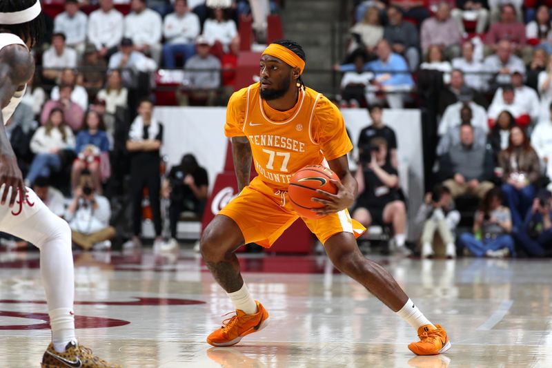 Jan 24, 2026; Tuscaloosa, Alabama, USA; Tennessee Volunteers guard Amaree Abram (77) dribbles the ball during the first half against the Alabama Crimson Tide at Coleman Coliseum. Mandatory Credit: David Leong-Imagn Images