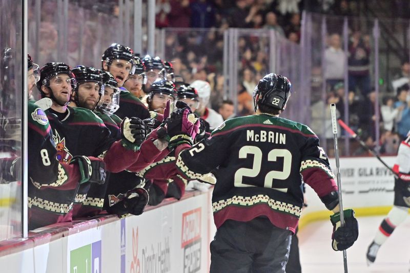 Dec 19, 2023; Tempe, Arizona, USA; Arizona Coyotes center Jack McBain (22) celebrates with teammatesa after scoring a goal in the second period against the Ottawa Senators at Mullett Arena. Mandatory Credit: Matt Kartozian-USA TODAY Sports