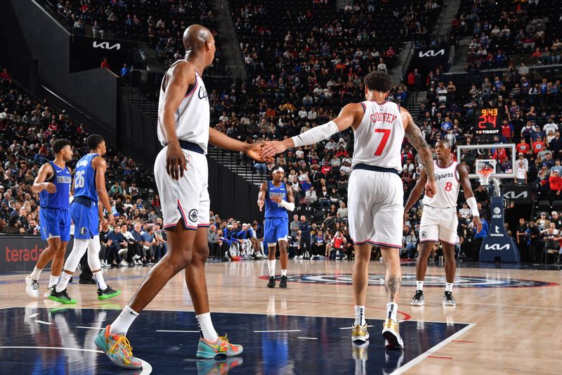 INGLEWOOD, CA - OCTOBER 14: Kai Jones #23 and Amir Coffey #7 of the LA Clippers high five during the game against the Dallas Mavericks on October 14, 2024 at Intuit Dome in Los Angeles, California. NOTE TO USER: User expressly acknowledges and agrees that, by downloading and/or using this Photograph, user is consenting to the terms and conditions of the Getty Images License Agreement. Mandatory Copyright Notice: Copyright 2024 NBAE (Photo by Juan Ocampo/NBAE via Getty Images)