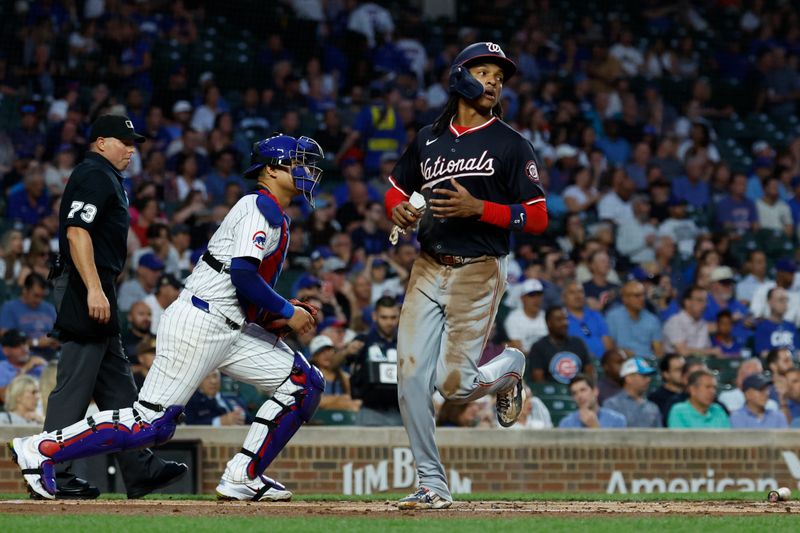 Sep 19, 2024; Chicago, Illinois, USA; Washington Nationals shortstop CJ Abrams (5) scores against the Chicago Cubs during the first inning at Wrigley Field. Mandatory Credit: Kamil Krzaczynski-Imagn Images