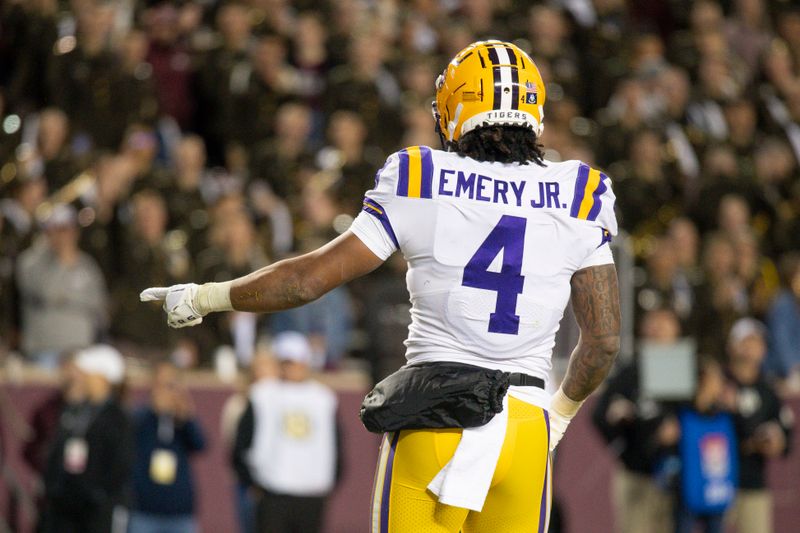 Nov 26, 2022; College Station, Texas, USA; LSU Tigers running back John Emery Jr. (4) scores a touchdown against the Texas A&M Aggies during the second quarter at Kyle Field. Mandatory Credit: Jerome Miron-USA TODAY Sports