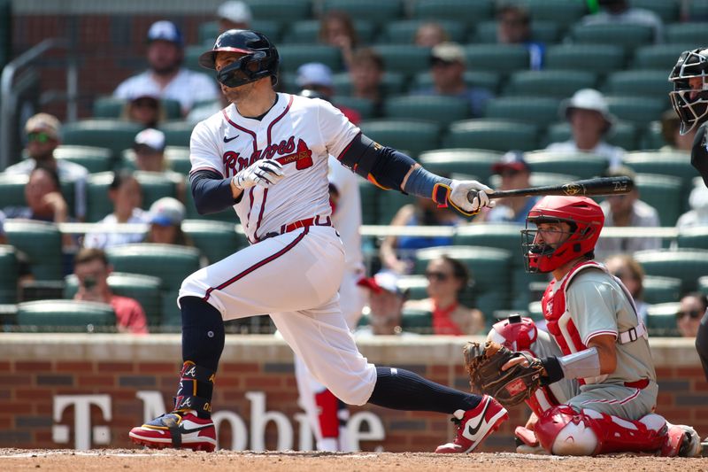 Jul 7, 2024; Atlanta, Georgia, USA; Atlanta Braves right fielder Adam Duvall (14) hits a double against the Philadelphia Phillies in the eighth inning at Truist Park. Mandatory Credit: Brett Davis-USA TODAY Sports
