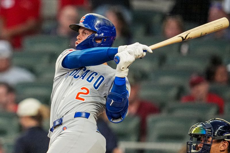 Sep 10, 2025; Cumberland, Georgia, USA; Chicago Cubs second baseman Nico Hoerner (2) singles against the Atlanta Braves during the third inning at Truist Park. Mandatory Credit: Dale Zanine-Imagn Images