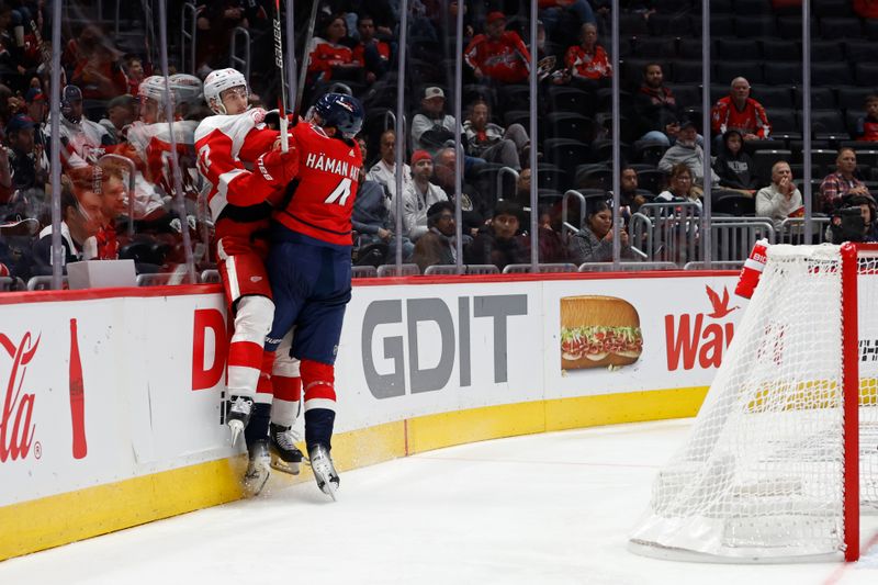 Sep 28, 2023; Washington, District of Columbia, USA; Washington Capitals defenseman Hardy Hayman-Aktel (4). Checks Detroit Red Wings defenseman Simon Edvinsson (77) in the third period at Capital One Arena. Mandatory Credit: Geoff Burke-USA TODAY Sports