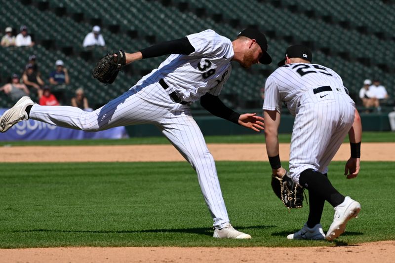 Aug 23, 2023; Chicago, Illinois, USA;  Chicago White Sox starting pitcher Michael Kopech (34) and Chicago White Sox first baseman Andrew Vaughn (25) try and make a play on the RBI single hit by Seattle Mariners third baseman Josh Rojas (4)  against the Chicago White Sox during the seventh inning at Guaranteed Rate Field. Mandatory Credit: Matt Marton-USA9TODAY Sports