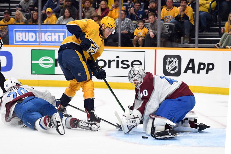 Mar 2, 2024; Nashville, Tennessee, USA; Nashville Predators center Mark Jankowski (17) has his shot blocked by Colorado Avalanche goaltender Alexandar Georgiev (40) during the first period at Bridgestone Arena. Mandatory Credit: Christopher Hanewinckel-USA TODAY Sports