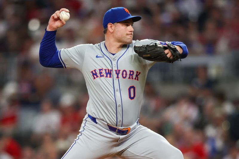 Sep 24, 2024; Atlanta, Georgia, USA; New York Mets relief pitcher Adam Ottavino (0) throws against the Atlanta Braves in the seventh inning at Truist Park. Mandatory Credit: Brett Davis-Imagn Images