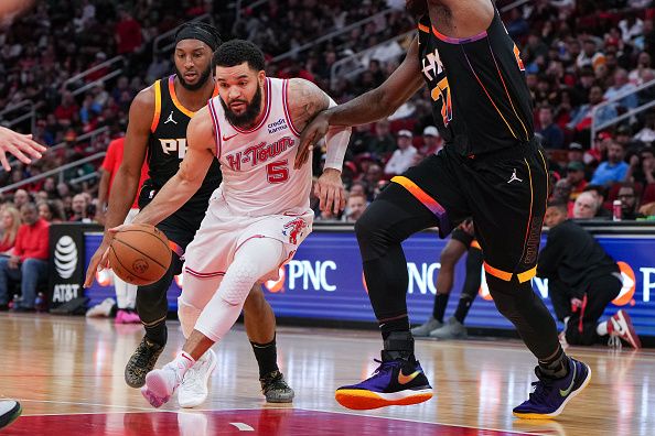 HOUSTON, TEXAS - DECEMBER 27: Fred VanVleet #5 of the Houston Rockets dribbles the ball during the third quarter of the game against the Phoenix Suns at Toyota Center on December 27, 2023 in Houston, Texas. User expressly acknowledges and agrees that, by downloading and or using this photograph, User is consenting to the terms and conditions of the Getty Images License Agreement. (Photo by Alex Bierens de Haan/Getty Images)