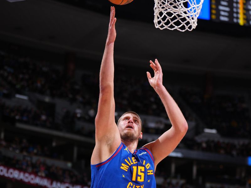 DENVER, CO - NOVEMBER 8: Nikola Jokic #15 of the Denver Nuggets drives to the basket during the game against the Miami Heat on November 8, 2024 at Ball Arena in Denver, Colorado. NOTE TO USER: User expressly acknowledges and agrees that, by downloading and/or using this Photograph, user is consenting to the terms and conditions of the Getty Images License Agreement. Mandatory Copyright Notice: Copyright 2024 NBAE (Photo by Garrett Ellwood/NBAE via Getty Images)