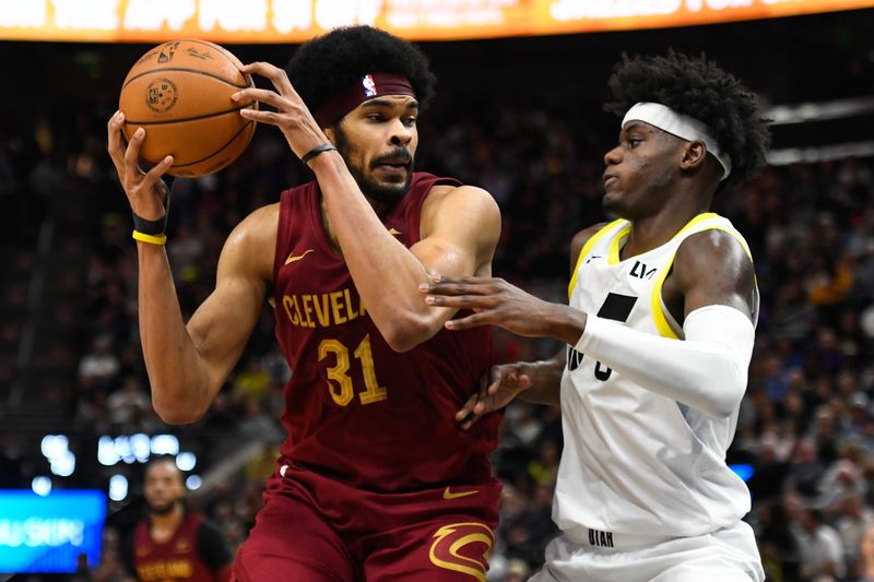 SALT LAKE CITY, UTAH - APRIL 02: Jarrett Allen #31 of the Cleveland Cavaliers drives against Taylor Hendricks #0 of the Utah Jazz during the second half of a game at Delta Center on April 02, 2024 in Salt Lake City, Utah. NOTE TO USER: User expressly acknowledges and agrees that, by downloading and or using this photograph, User is consenting to the terms and conditions of the Getty Images License Agreement. (Photo by Alex Goodlett/Getty Images)