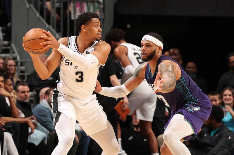 CHARLOTTE, NC - JANUARY 19: Keldon Johnson #3 of the San Antonio Spurs handles the ball during the game against the Charlotte Hornets on January 19, 2024 at Spectrum Center in Charlotte, North Carolina. NOTE TO USER: User expressly acknowledges and agrees that, by downloading and or using this photograph, User is consenting to the terms and conditions of the Getty Images License Agreement. Mandatory Copyright Notice: Copyright 2024 NBAE (Photo by Kent Smith/NBAE via Getty Images)