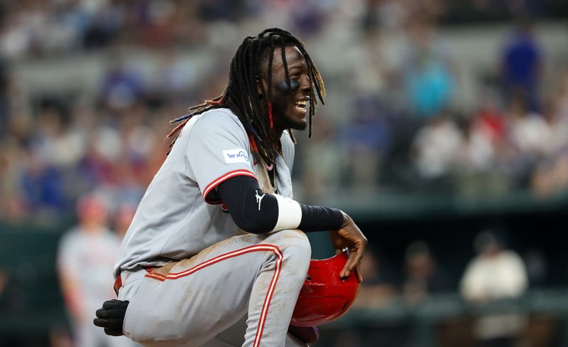 Apr 26, 2024; Arlington, Texas, USA;  Cincinnati Reds shortstop Elly De La Cruz (44) reacts after sliding safely into third base during the first inning against the Texas Rangers at Globe Life Field. Mandatory Credit: Kevin Jairaj-USA TODAY Sports