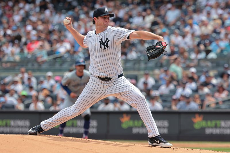 Aug 4, 2024; Bronx, New York, USA; New York Yankees starting pitcher Gerrit Cole (45) delivers a pitch during the first inning against the Toronto Blue Jays at Yankee Stadium. Mandatory Credit: Vincent Carchietta-USA TODAY Sports