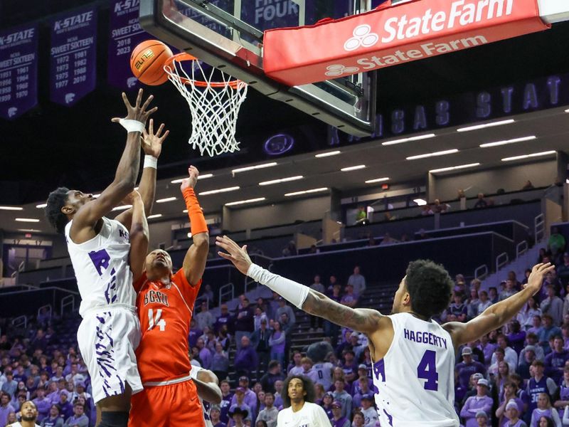 Dec 1, 2025; Manhattan, Kansas, USA; Bowling Green Falcons forward Sam Towns (14) and Kansas State Wildcats guard Mobi Ikegwuruka (14) go after a rebound during the second half at Bramlage Coliseum. Mandatory Credit: Scott Sewell-Imagn Images