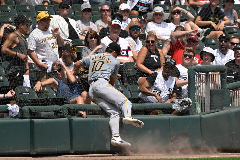 Jul 13, 2024; Chicago, Illinois, USA;  Pittsburgh Pirates outfielder Bryan Reynolds (10) chases a foul ball into the stands during the fourth inning against the Chicago White Sox at Guaranteed Rate Field. Mandatory Credit: Matt Marton-USA TODAY Sports