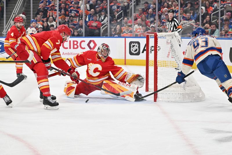 Dec 23, 2025; Edmonton, Alberta, CAN; Edmonton Oilers Centre Ryan Nugent-Hopkins (93) shoots as Calgary Flames goalie Dustin Wolf (32) defends during the first period at Rogers Place. Mandatory Credit: Walter Tychnowicz-Imagn Images