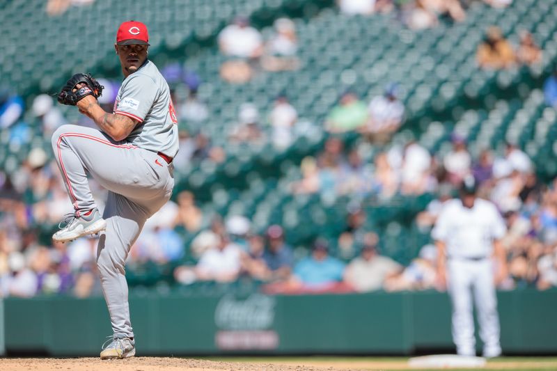 Jun 5, 2024; Denver, Colorado, USA; Cincinnati Reds relief pitcher Fernando Cruz (63) delivers a pitch during the eighth inning against the Colorado Rockies at Coors Field. Mandatory Credit: Andrew Wevers-USA TODAY Sports