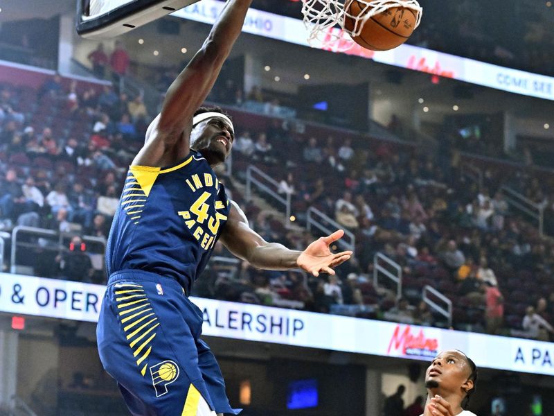 CLEVELAND, OHIO - OCTOBER 10: Pascal Siakam #43 of the Indiana Pacers dunks over Isaac Okoro #35 of the Cleveland Cavaliers during the first half of a preseason game at Rocket Mortgage Fieldhouse on October 10, 2024 in Cleveland, Ohio. NOTE TO USER: User expressly acknowledges and agrees that, by downloading and or using this photograph, User is consenting to the terms and conditions of the Getty Images License Agreement. (Photo by Jason Miller/Getty Images)