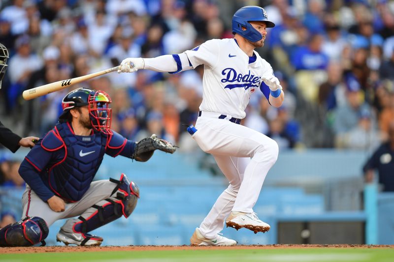 May 4, 2024; Los Angeles, California, USA; Los Angeles Dodgers second baseman Gavin Lux (9) hits a single against the Atlanta Braves during the second inning at Dodger Stadium. Mandatory Credit: Gary A. Vasquez-USA TODAY Sports