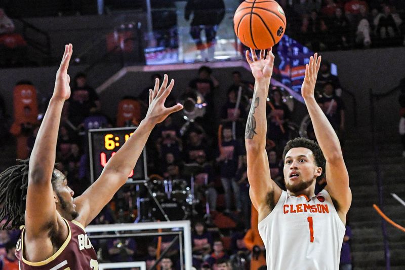 Jan 13, 2024; Clemson, South Carolina, USA; Clemson Tigers guard Chase Hunter (1) shoots the ball against Boston College Eagles guard Claudell Harris Jr. (left) during the second half at Littlejohn Coliseum. Mandatory Credit: Ken Ruinard-USA TODAY Sports