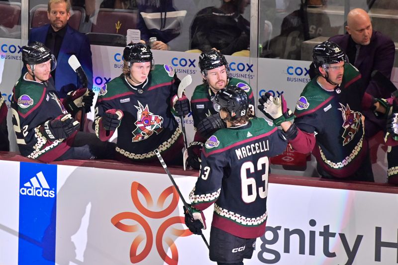 Nov 7, 2023; Tempe, Arizona, USA; Arizona Coyotes left wing Matias Maccelli (63) celebrates with teammates after scoring a goal in the first period against the Seattle Kraken at Mullett Arena. Mandatory Credit: Matt Kartozian-USA TODAY Sports