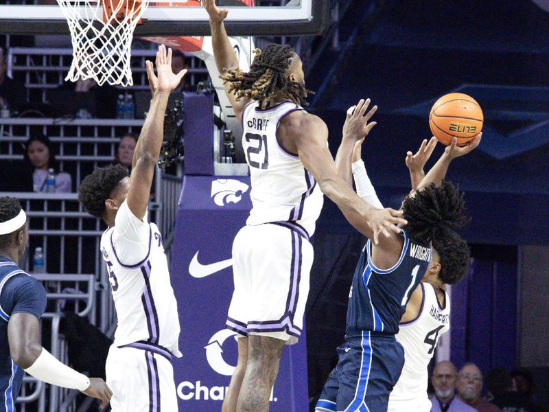 Jan 3, 2026; Manhattan, Kansas, USA; Kansas State Wildcats guard David Castillo (10) dribbles against Brigham Young Cougars forward Mihailo Boskovic (5) during the second half at Bramlage Coliseum. Mandatory Credit: Scott Sewell-Imagn Images