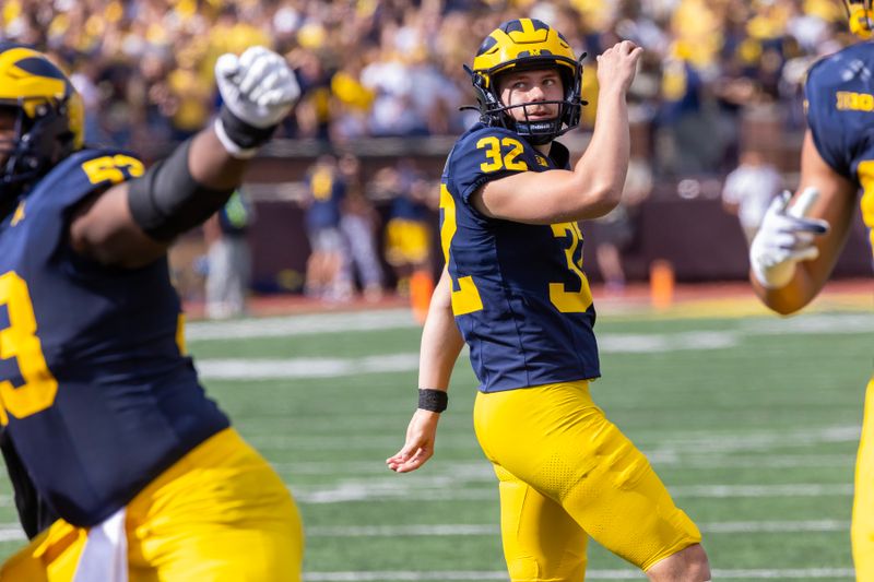 Sep 9, 2023; Ann Arbor, Michigan, USA; Michigan Wolverines place kicker James Turner (32) kicks an extra point against the UNLV Rebels during the first half at Michigan Stadium. Mandatory Credit: David Reginek-USA TODAY Sports