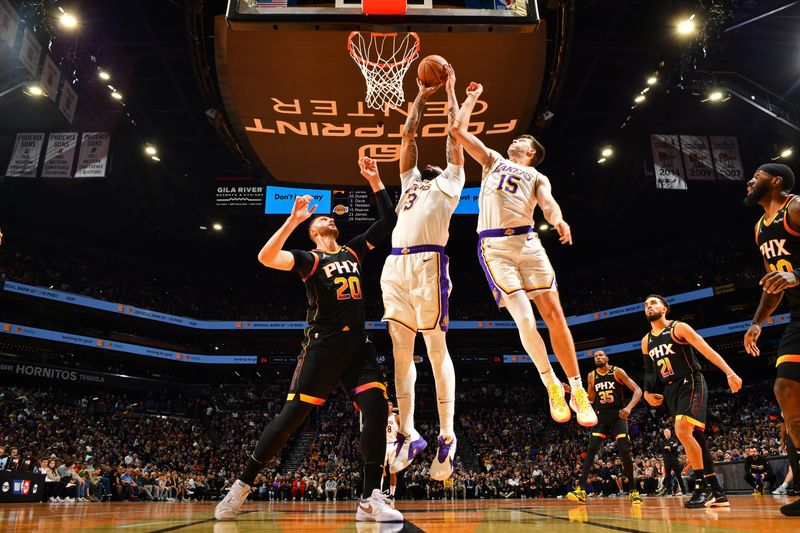 PHOENIX, AZ - NOVEMBER 26: Anthony Davis #3 of the Los Angeles Lakers drives to the basket during the game against the Phoenix Suns during the Emirates NBA Cup game on November 26, 2024 at Footprint Center in Phoenix, Arizona. NOTE TO USER: User expressly acknowledges and agrees that, by downloading and or using this photograph, user is consenting to the terms and conditions of the Getty Images License Agreement. Mandatory Copyright Notice: Copyright 2024 NBAE (Photo by Barry Gossage/NBAE via Getty Images)