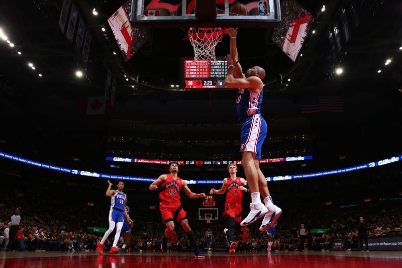 TORONTO, CANADA - MARCH 31: Nicolas Batum #40 of the Philadelphia 76ers drives to the basket during the game against the Toronto Raptors on March 31, 2024 at the Scotiabank Arena in Toronto, Ontario, Canada.  NOTE TO USER: User expressly acknowledges and agrees that, by downloading and or using this Photograph, user is consenting to the terms and conditions of the Getty Images License Agreement.  Mandatory Copyright Notice: Copyright 2024 NBAE (Photo by Vaughn Ridley/NBAE via Getty Images)