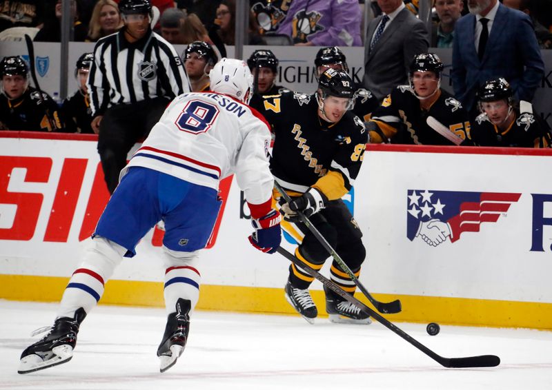 Feb 22, 2024; Pittsburgh, Pennsylvania, USA; Pittsburgh Penguins center Sidney Crosby (87) moves the puck against Montreal Canadiens defenseman Mike Matheson (8) during the first period at PPG Paints Arena. Mandatory Credit: Charles LeClaire-USA TODAY Sports