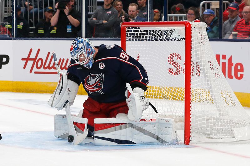 Oct 15, 2024; Columbus, Ohio, USA; Columbus Blue Jackets goalie Elvis Merzlikins (90) makes a save a stick save against the Florida Panthers during the first period at Nationwide Arena. Mandatory Credit: Russell LaBounty-Imagn Images