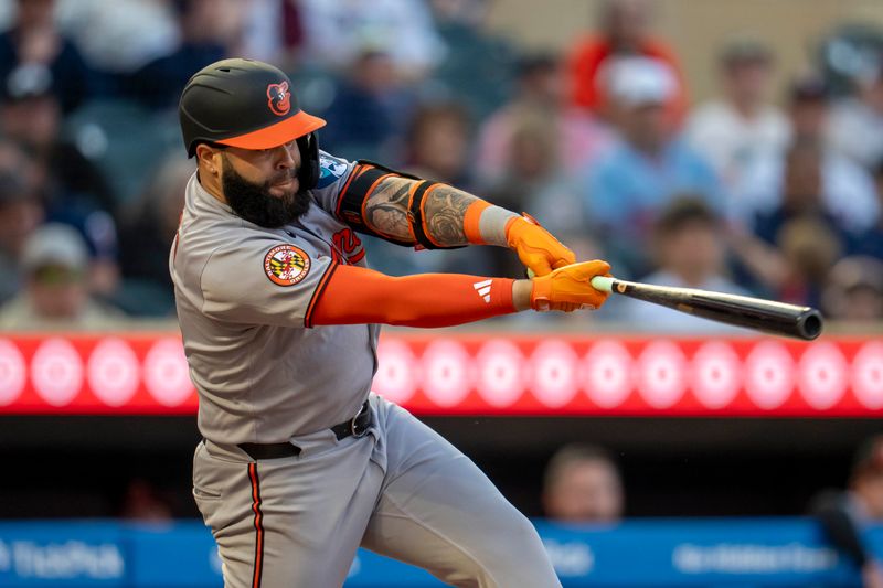May 7, 2025; Minneapolis, Minnesota, USA; Baltimore Orioles third baseman Emmanuel Rivera (26) hits a single against the Minnesota Twins in the fifth inning at Target Field. Mandatory Credit: Jesse Johnson-Imagn Images