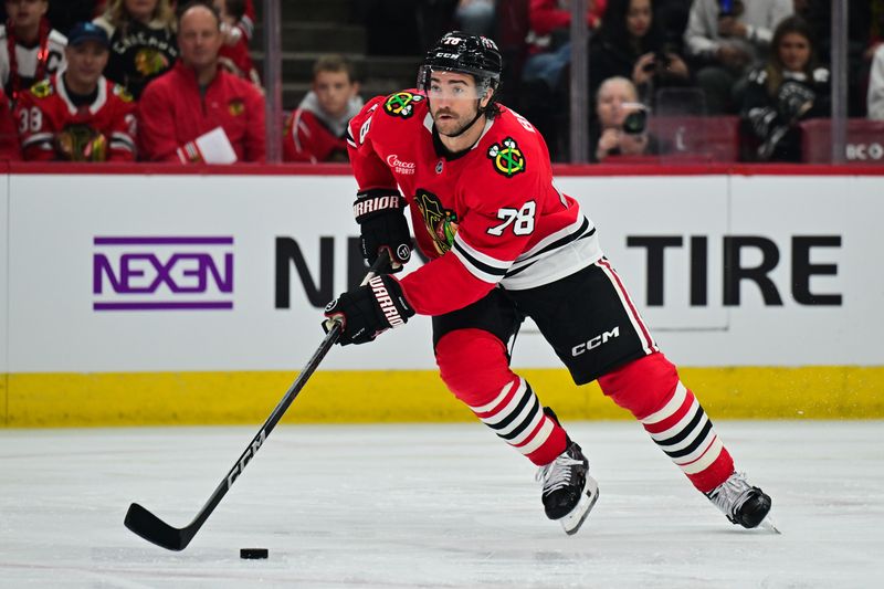 Nov 21, 2024; Chicago, Illinois, USA; Chicago Blackhawks defenseman T.J. Brodie (78) skates with the puck against the Florida Panthers during the first period at the United Center. Mandatory Credit: Daniel Bartel-Imagn Images