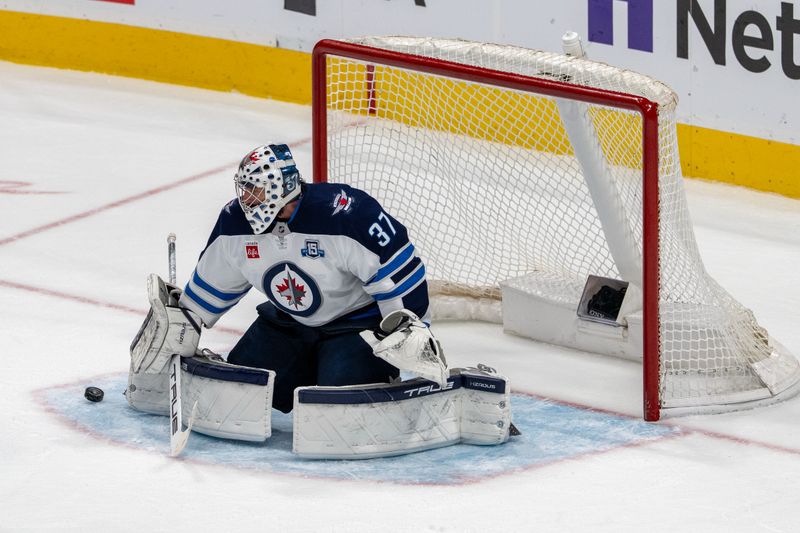 March 1, 2026; San Jose, California, USA; Winnipeg Jets goaltender Connor Hellebuyck (37) makes a save against the San Jose Sharks during the third period at SAP Center at San Jose. Mandatory Credit: Neville E. Guard-Imagn Images