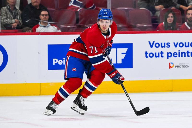 Oct 1, 2024; Montreal, Quebec, CAN; Montreal Canadiens center Jake Evans (71) tracks the play against the Ottawa Senators during the third period at Bell Centre. Mandatory Credit: David Kirouac-Imagn Images