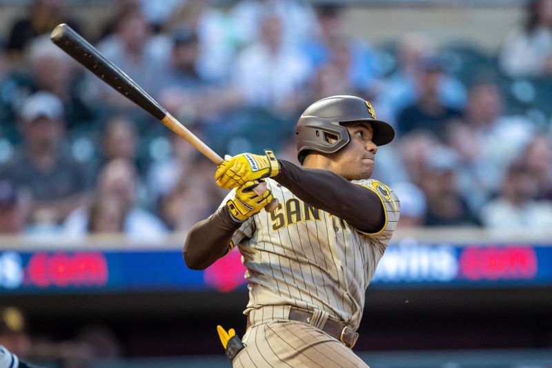 May 10, 2023; Minneapolis, Minnesota, USA; San Diego Padres left fielder Juan Soto (22) hits a solo home run in the seventh inning against the Minnesota Twins at Target Field. Mandatory Credit: Jesse Johnson-USA TODAY Sports