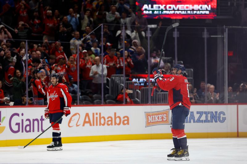 Nov 5, 2025; Washington, District of Columbia, USA; Washington Capitals left wing Alex Ovechkin (8) waves to the crowd after scoring his 900th NHL goal, against the St. Louis Blues, during the second period at Capital One Arena. Mandatory Credit: Geoff Burke-Imagn Images
