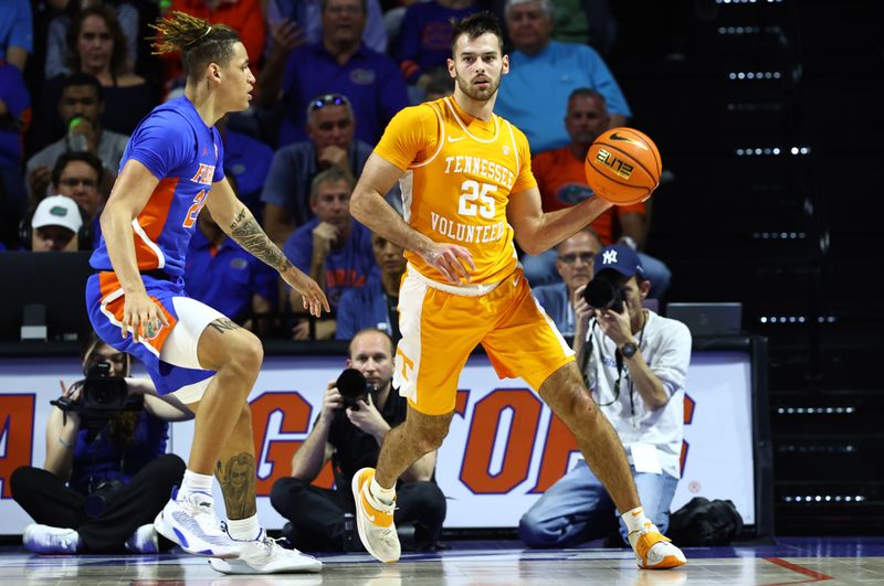 Feb 1, 2023; Gainesville, Florida, USA; Tennessee Volunteers guard Santiago Vescovi (25) passes the ball s Florida Gators guard Riley Kugel (24) defends during the first half at Exactech Arena at the Stephen C. O'Connell Center. Mandatory Credit: Kim Klement-USA TODAY Sports