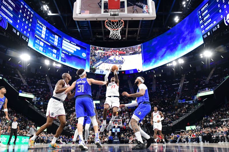 INGLEWOOD, CA - OCTOBER 14: Kevin Porter Jr. #77 of the LA Clippers shoots the ball during the game against the Dallas Mavericks during a NBA Preseason game on October 14, 2024 at the Intuit Dome in Inglewood, California. NOTE TO USER: User expressly acknowledges and agrees that, by downloading and/or using this Photograph, user is consenting to the terms and conditions of the Getty Images License Agreement. Mandatory Copyright Notice: Copyright 2024 NBAE (Photo by Adam Pantozzi/NBAE via Getty Images) <p><br/></p>