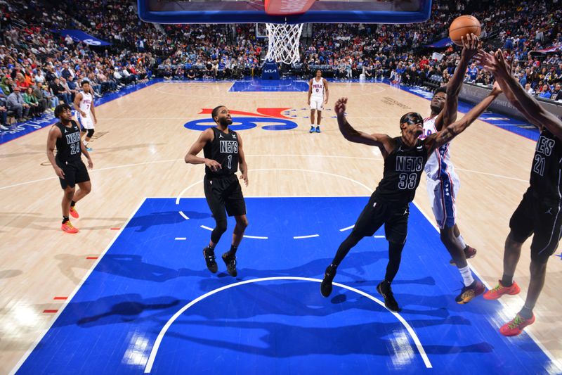 PHILADELPHIA, PA - APRIL 14: Mo Bamba #5 of the Philadelphia 76ers rebounds the ball during the game against the Brooklyn Nets on April 14, 2024 at the Wells Fargo Center in Philadelphia, Pennsylvania NOTE TO USER: User expressly acknowledges and agrees that, by downloading and/or using this Photograph, user is consenting to the terms and conditions of the Getty Images License Agreement. Mandatory Copyright Notice: Copyright 2024 NBAE (Photo by Jesse D. Garrabrant/NBAE via Getty Images)