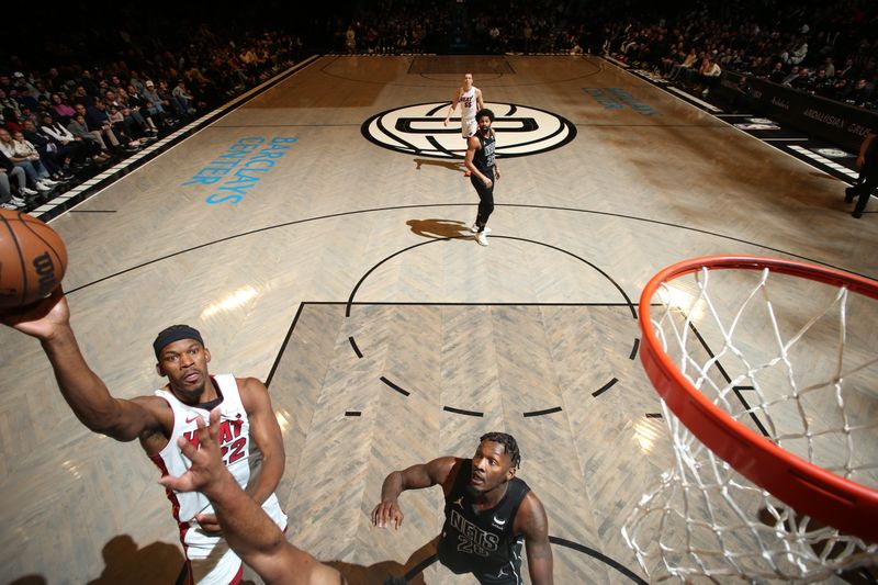 BROOKLYN, NY - JANUARY 15: Jimmy Butler #22 of the Miami Heat shoots the ball during the game against the Brooklyn Nets on January 15, 2024 at Barclays Center in Brooklyn, New York. NOTE TO USER: User expressly acknowledges and agrees that, by downloading and or using this Photograph, user is consenting to the terms and conditions of the Getty Images License Agreement. Mandatory Copyright Notice: Copyright 2024 NBAE (Photo by Nathaniel S. Butler/NBAE via Getty Images)