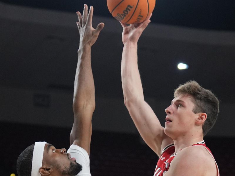 Feb 18, 2023; Tempe, Arizona, USA; Utah Utes forward Ben Carlson (1) shoots over Arizona State Sun Devils guard Devan Cambridge (35) during the first half at Desert Financial Arena. Mandatory Credit: Joe Camporeale-USA TODAY Sports