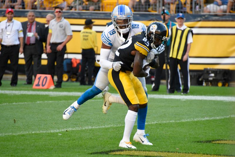 Pittsburgh Steelers wide receiver Steven Sims (82) makes a touchdown catch as Detroit Lions cornerback Saivion Smith (19) defends during the first half of an NFL preseason football game, Sunday, Aug. 28, 2022, in Pittsburgh. (AP Photo/Don Wright)