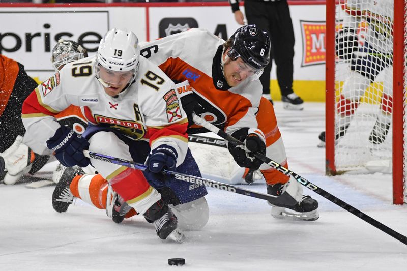 Mar 24, 2024; Philadelphia, Pennsylvania, USA; Florida Panthers left wing Matthew Tkachuk (19) controls the puck against Philadelphia Flyers defenseman Travis Sanheim (6) during the second period at Wells Fargo Center. Mandatory Credit: Eric Hartline-USA TODAY Sports